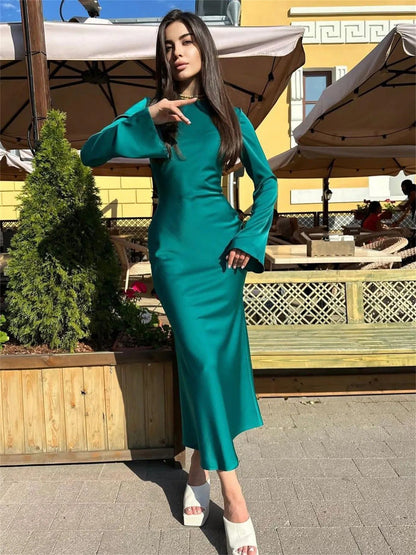 Aurora groene maxi jurk met lange mouwen en luxe uitstraling